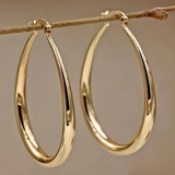 Pendientes elegantes de oro