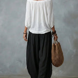 Top con hombros al descubierto y pantalones de farol