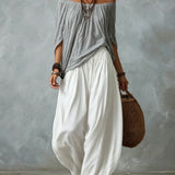 Top con hombros al descubierto y pantalones de farol