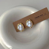 Elegantes pendientes de perla de Carmen