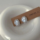Elegantes pendientes de perla de Carmen